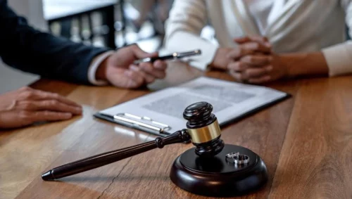 image of a person handing a pen to client with judge tools fishers in